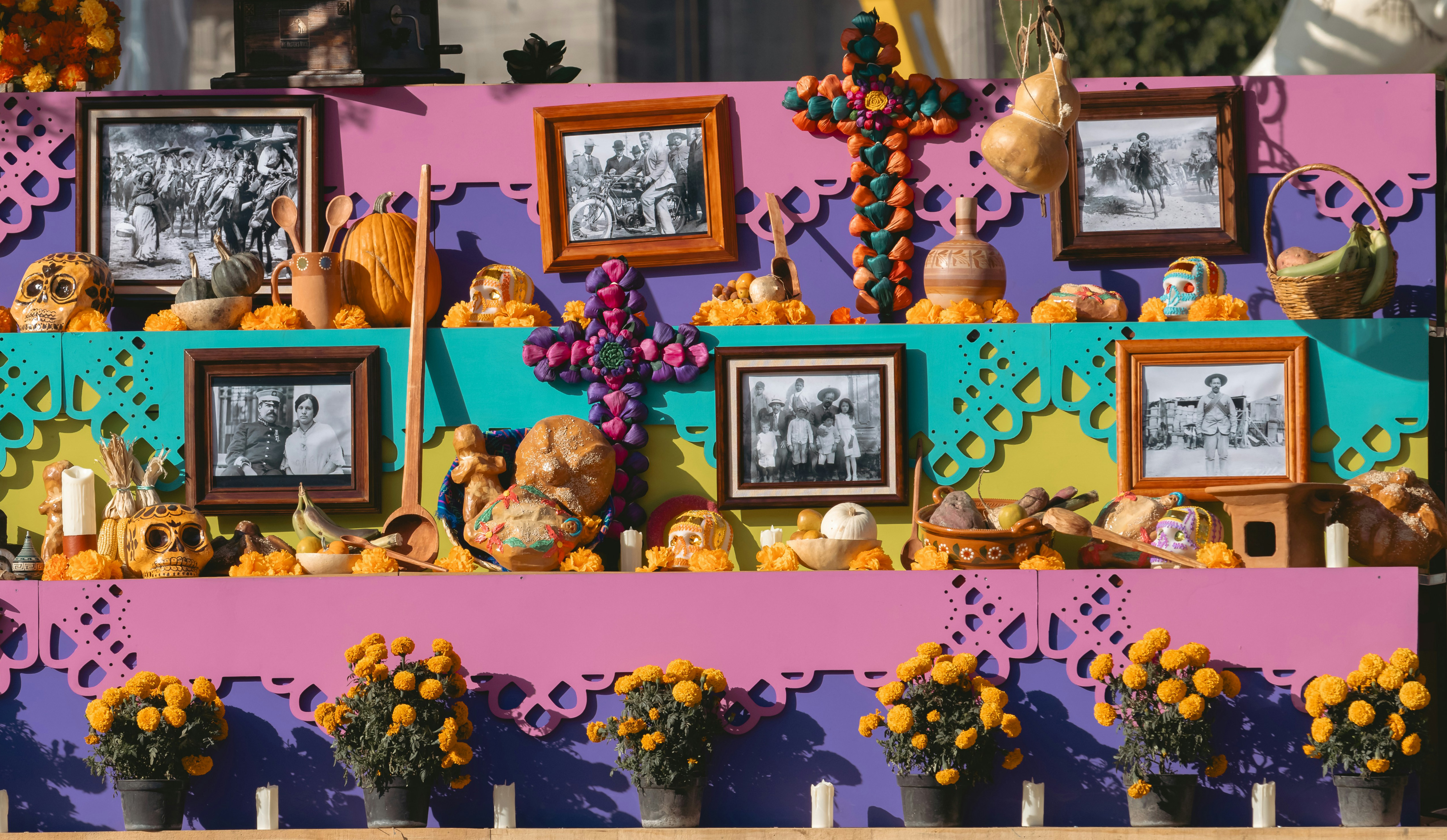 A framed photograph of the departed on a Day of the Dead ofrenda